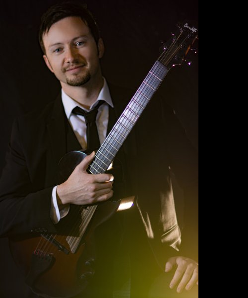 Jazz guitar, black suit. by Alex Hand Band